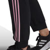 adidas - Pantalon Essentials Warm-Up Slim Tapered à 3 bandes pour femme (HP0461) 